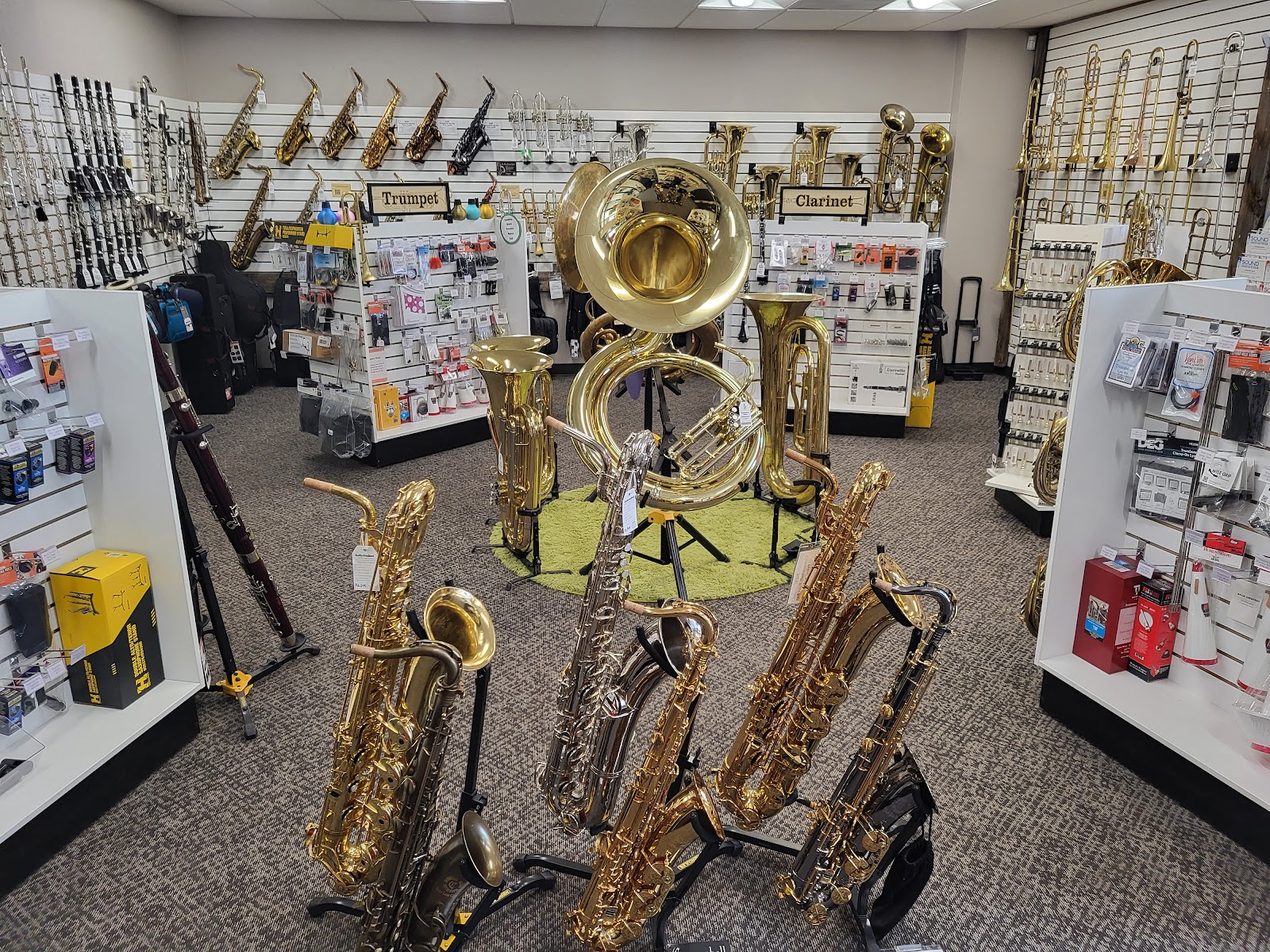 Brass and woodwind instruments arranged inside Rocky Mountain Music Repair